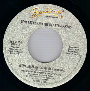 TOM PETTY , A WOMAN IN LOVE (ITS NOT ME) / GATOR ON THE LAWN 
